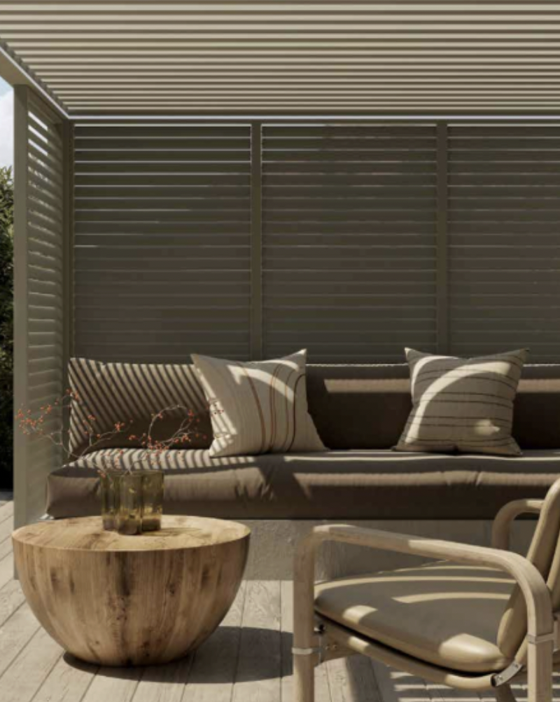 Bioclimatic pergola with fresh green finish inspired by natural garden surroundings